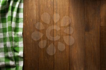 checked napkin on wooden background