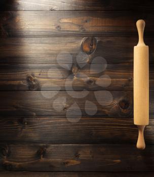 rolling pin on brown background texture