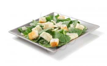 caesar salad in plate isolated on white background
