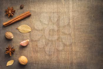 spices and ingredients on wooden table background, top view