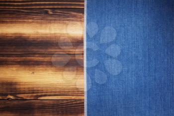 blue jeans texture on wooden background surface