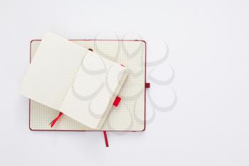 notebook at white paper background, top view