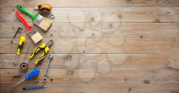 set of tools and instruments at wooden surface background