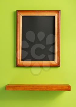 picture frame and shelf at wall background surface