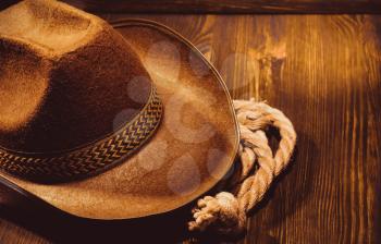 cowboy hat on wooden background