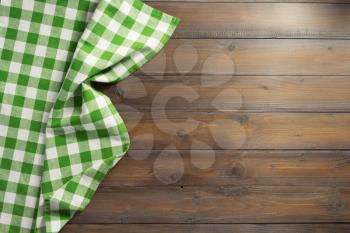 checked napkin cloth on wooden background