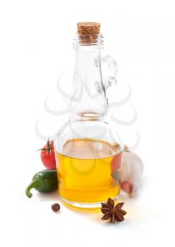 bottle of oil isolated and spices at white background