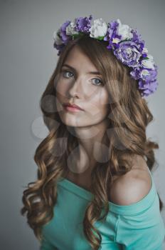 Portrait of a girl with the lilac wreath.