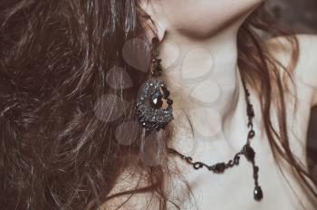 Beautiful black necklace on a neck of the woman.