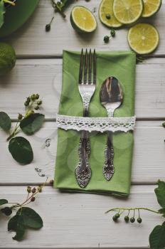 Napkin with a fork and a teaspoon.