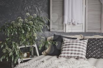 White beige decoration in photo Studio, with the bed by the window.