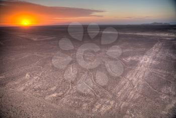 Nazca Lines in the beautiful sunset. Top view.