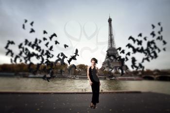 girl and a flock of crows Paris. Architecture of Paris .France. Europe
