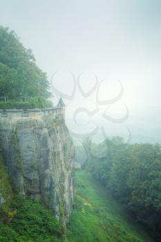fortress Königstein. autumn fog and the mountain with the castle.