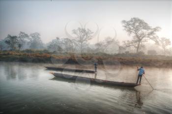 Chitwan National Park. The park is 932 sq. km, is mainly covered by jungle.