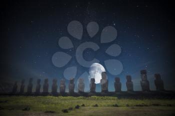 Moais at Ahu Tongariki (Easter island, Chile). night shining moon and stars