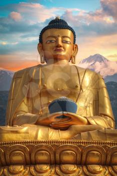 Golden Buddha in Kathmandu on a background of the Himalayas mountains