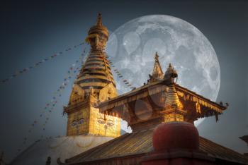 Swayambhunath Stupa stands on the hill in Kathmandu, Nepal. moon