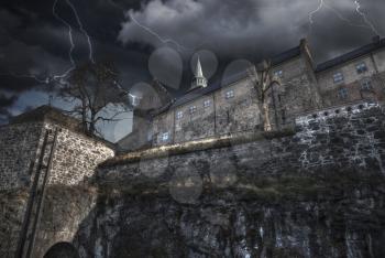 Heavy thunderstorm with lightning. fortress of Akershus - a castle in Oslo, the capital of Norway.