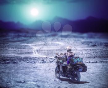 biker in the Atacama travels alone in the desert.