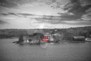 Archipelago on the Baltic Sea coast in Sweden. black and red and white photo