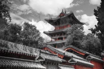 Shaolin is a Buddhist monastery in central China. . black and red and white photo