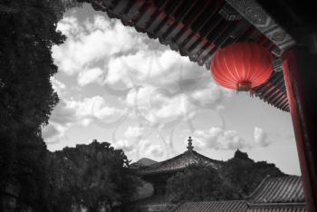 Shaolin is a Buddhist monastery in central China.  black and red and white photo