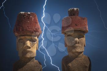 Strong thunder and powerful flashes of lightning.A statue on Easter Island or Rapa Nui in the southeastern Pacific, the territory of Chile.
