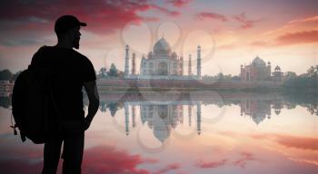silhouette of a man against the background of the Taj Mahal. India