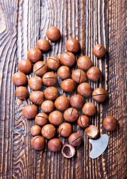 macadamia nuts on the wooden table, macadamia on a table
