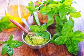 pesto sauce in bowl and on a table