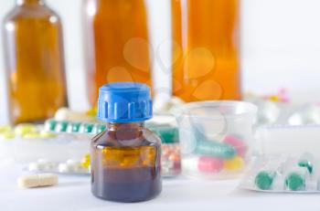 color pills and medical bottle