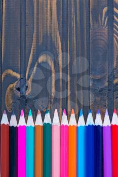 pencils on the wooden table, color pencils 