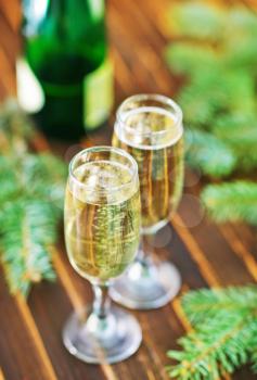 two shampagne glasses and brunch of christmas tree