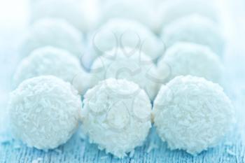 coconut balls with cream on the white table