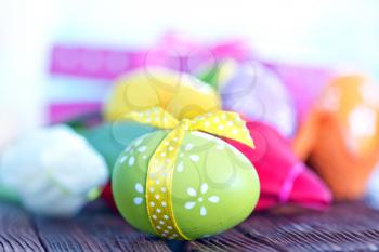 easter eggs and box for present on a table