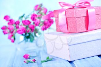boxes for presents and floers on a table