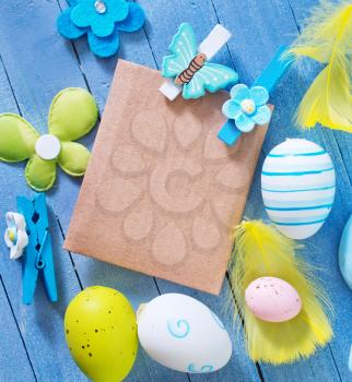 easter background, easter eggs on blue table