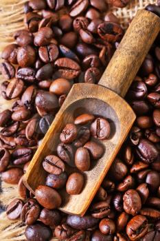 coffee beans on the wooden table, roast coffee beans