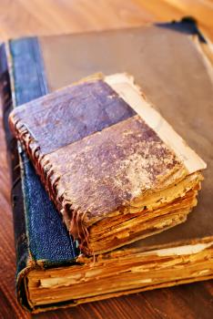 old books on the wooden table, stack of books
