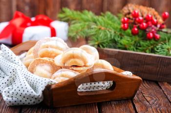christmas cookies with creame on the wooden tray