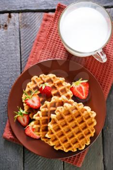 waffles on plate and on a table