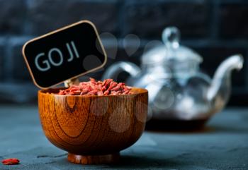 dry goji in bowl and on a table