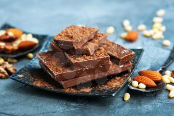 chocolate and nuts on plate, stock photo