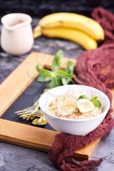 oat porridge with fresh banana in the bowl