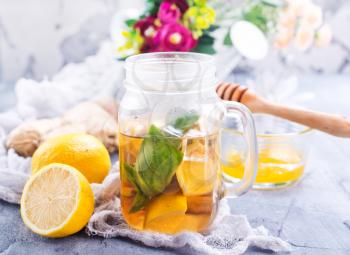 lemonade with fresh lemon and ginger on a table