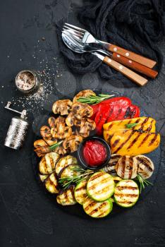 Grilled vegetables with sauce, grilled vegetables on black board