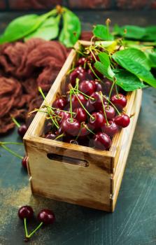 Fresh cherry, Cherries with leaves in wooden box 