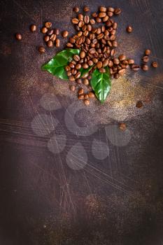 coffee beans and green leaf on a table