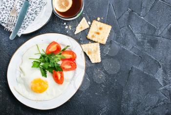 fried eggs with salad on the plate, stock photo